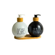 Set 2 distributeurs à savon ronds noir et blanc avec support en bois